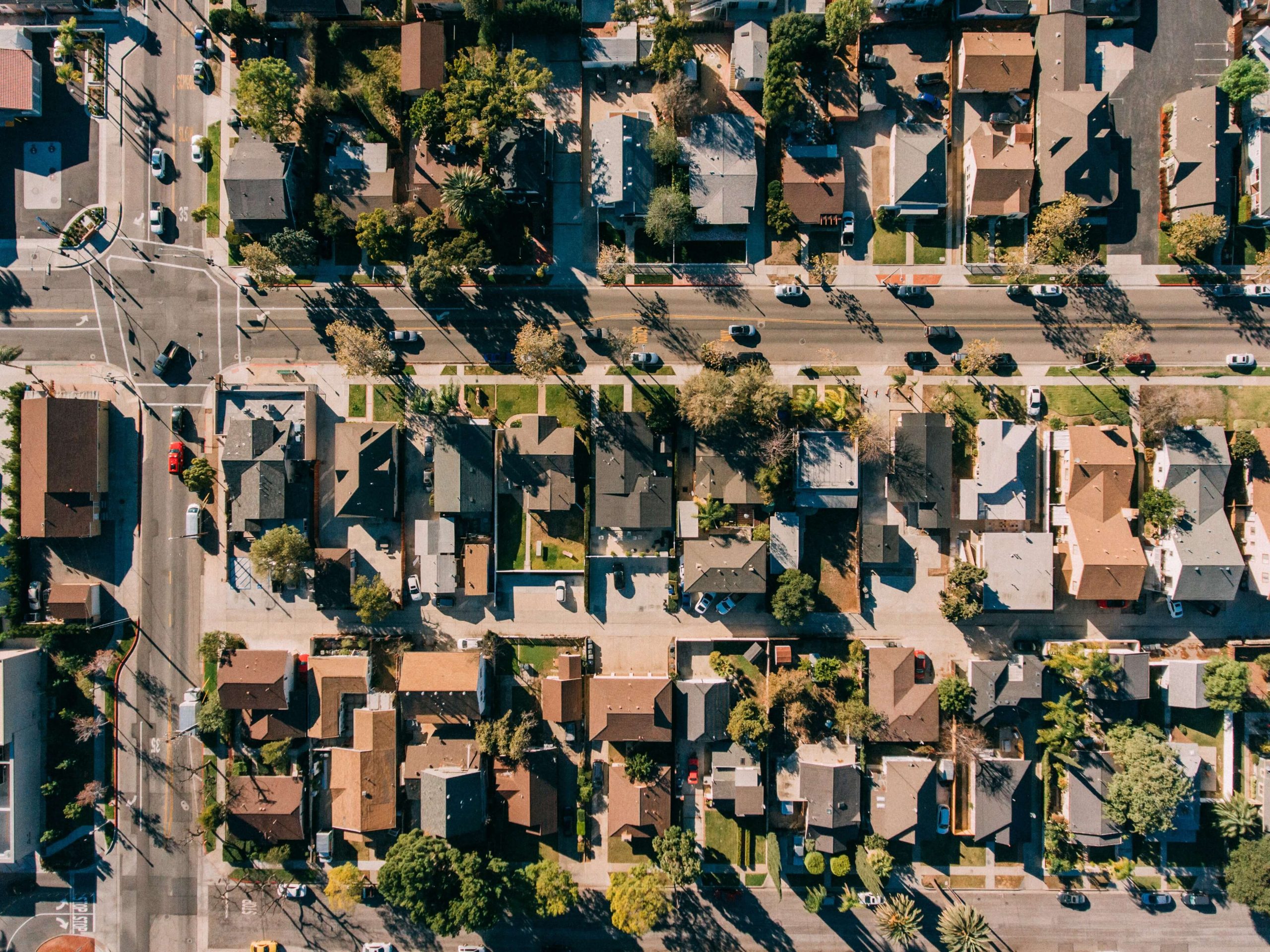 Aerial view of a well-maintained suburban neighborhood representing organized, professional HOA management.