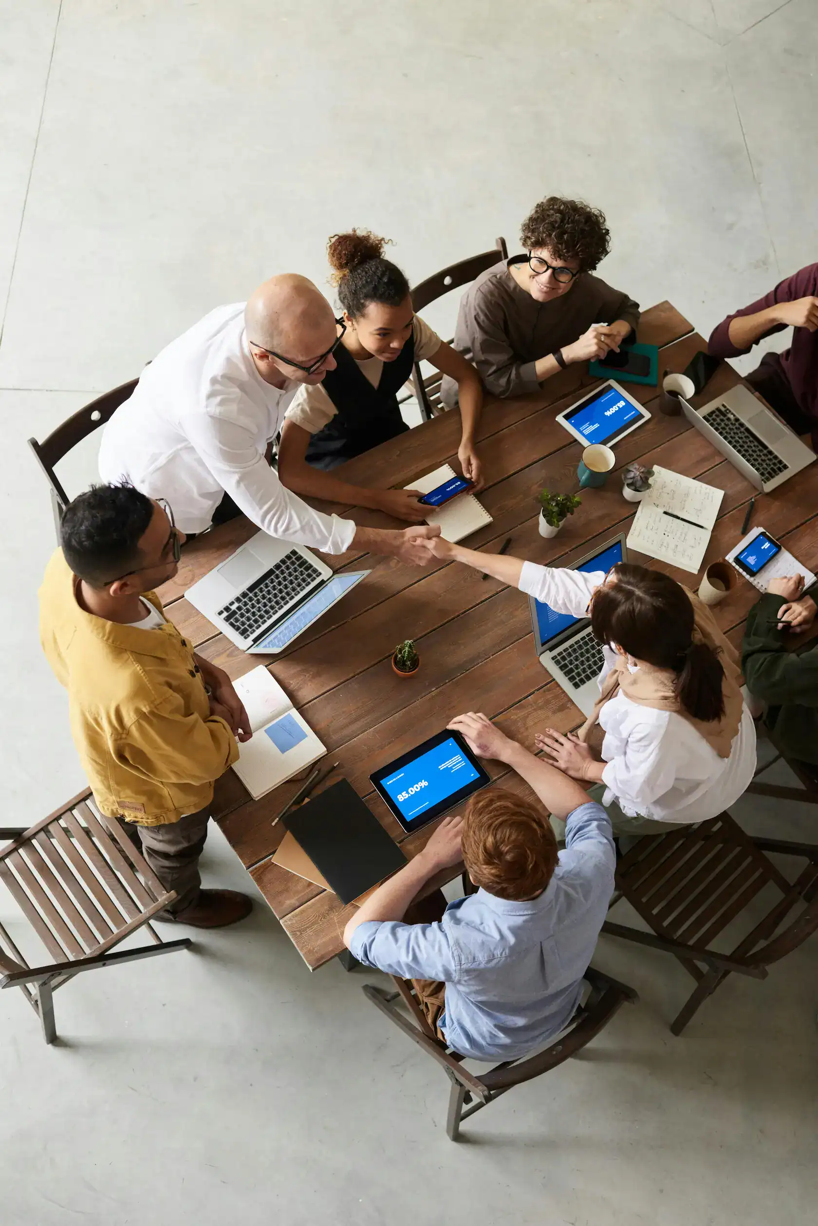 HOA board members and management team collaborating around a conference table during a professional meeting in Snoqualmie, Washington.