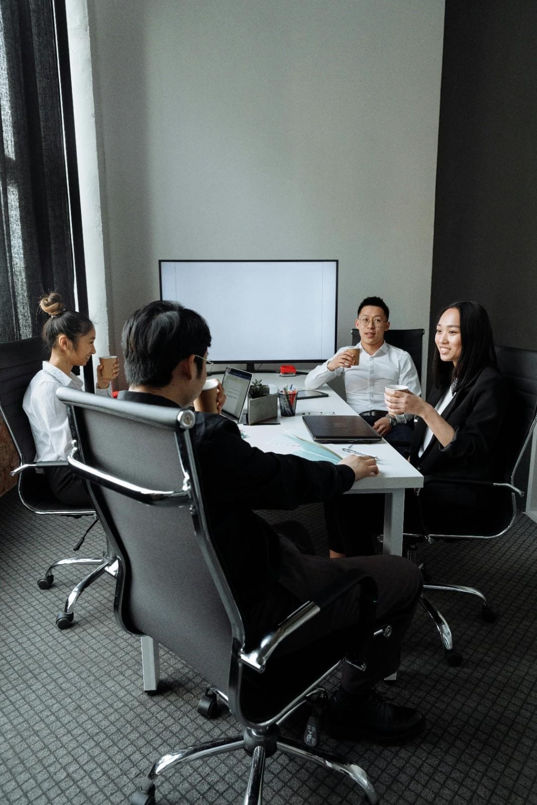 HOA management professionals meeting with clients in a modern office in Hillsboro, Oregon.